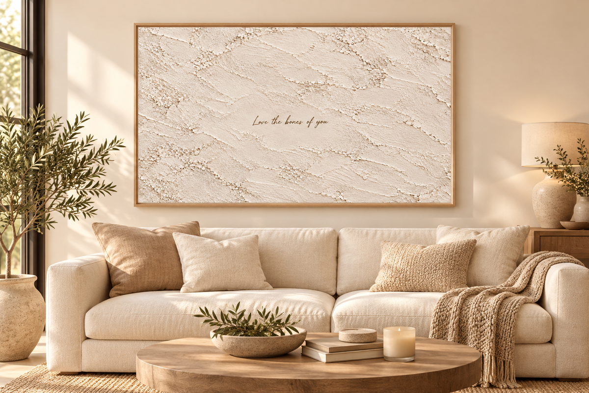 Love the Bones of You quote artwork above a cream sofa