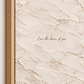Close-up of quote artwork in a light wood float frame