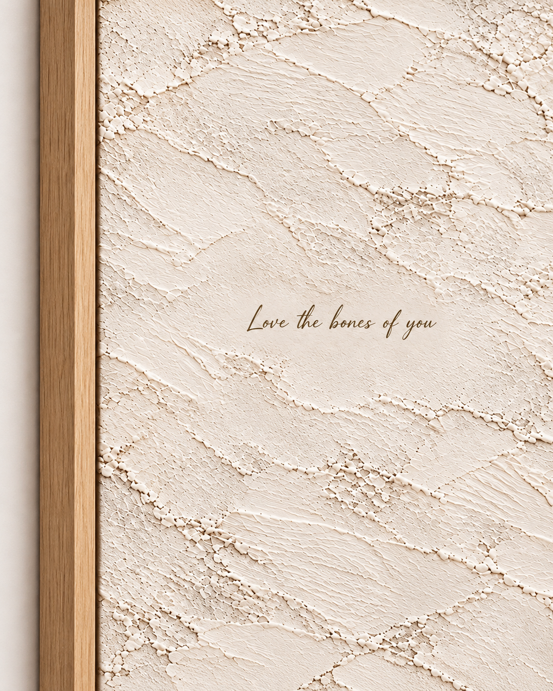 Close-up of quote artwork in a light wood float frame