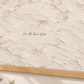 Close view of the lettering and plaster-effect artwork