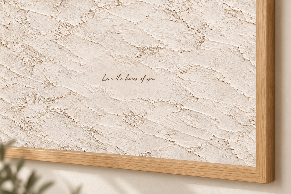 Close view of the lettering and plaster-effect artwork
