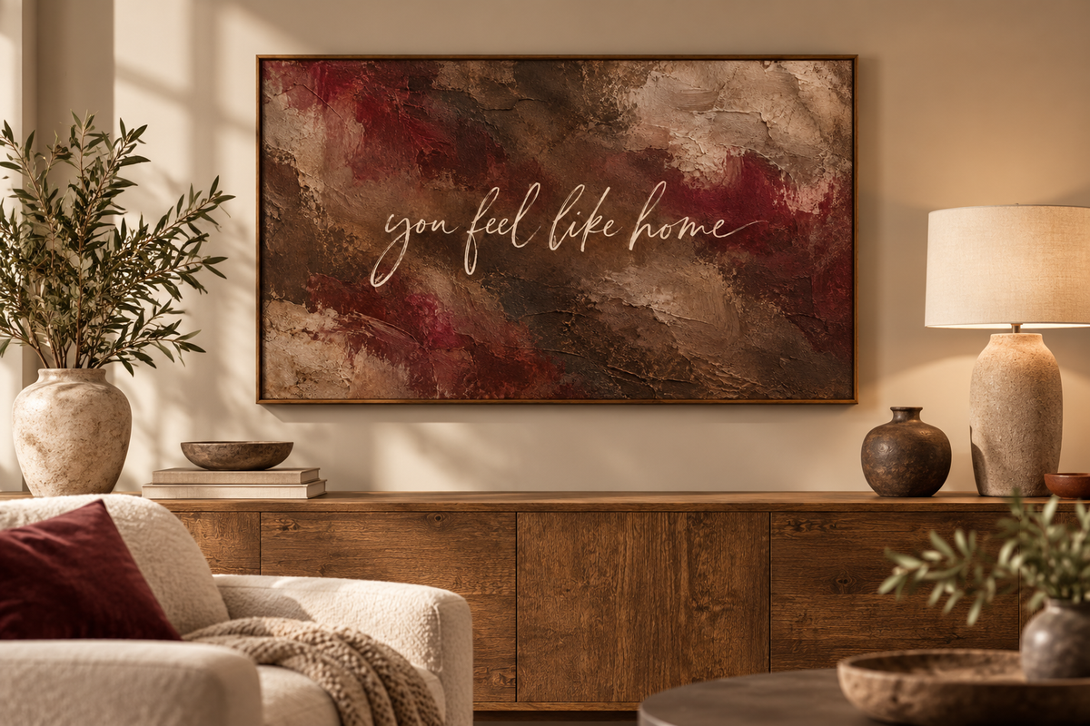 Burgundy quote artwork displayed above a wooden console