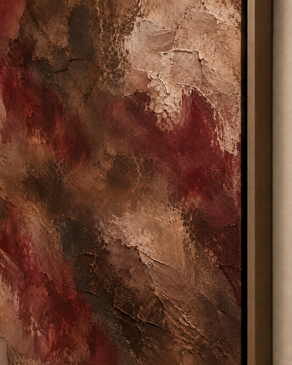 Close-up of burgundy and brown artwork in a dark wood float frame