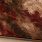 Close-up of the artwork's brown and burgundy plaster effect and dark frame