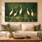 Five ivory birds in a forest green landscape displayed above a sofa