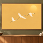 Golden bird artwork on an olive green wall