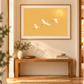 Mounted framed print of Golden Flight in a hallway