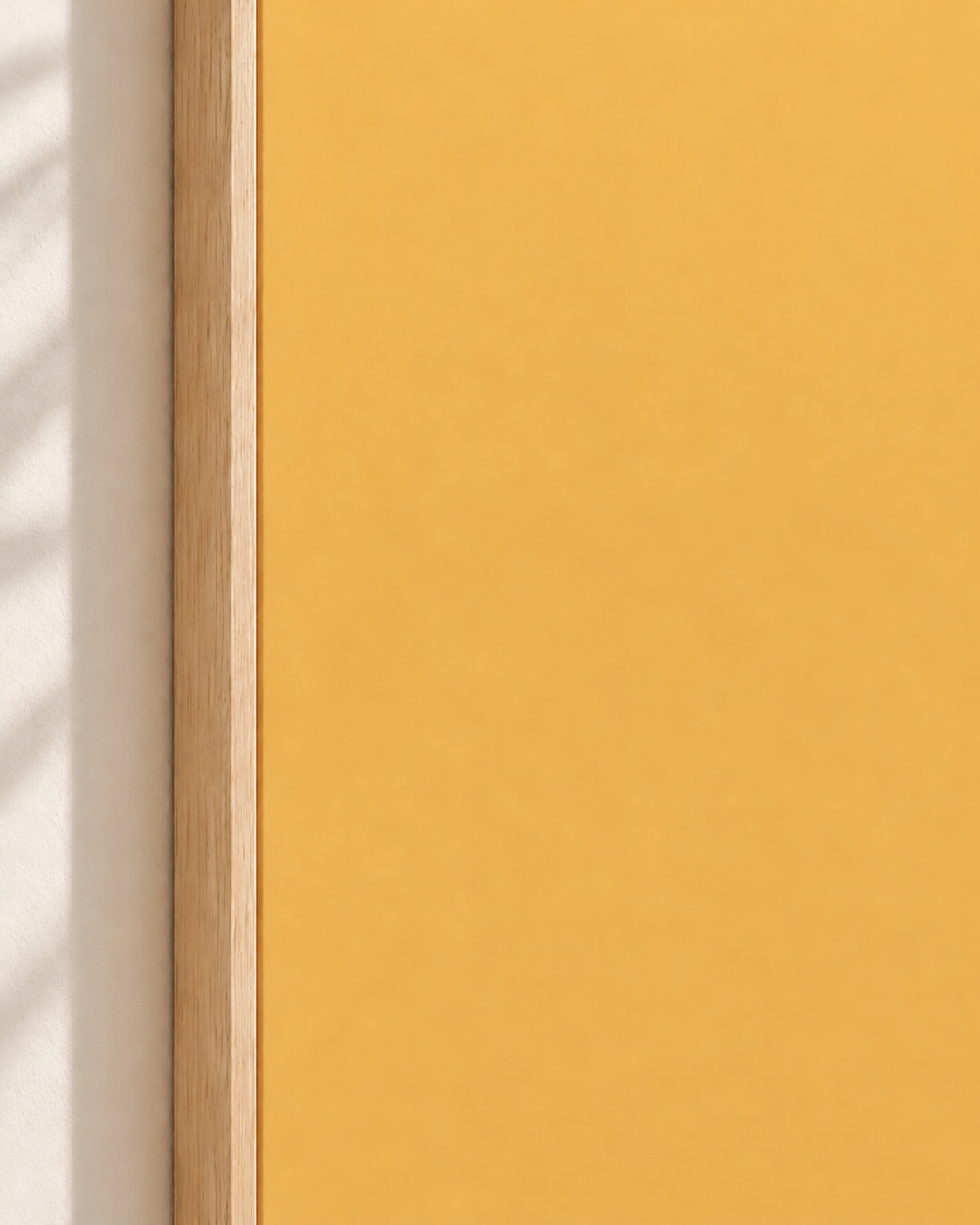 Close-up of light wood float frame and smooth golden canvas colour