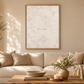 Here We Are Home quote art in a warm neutral living room