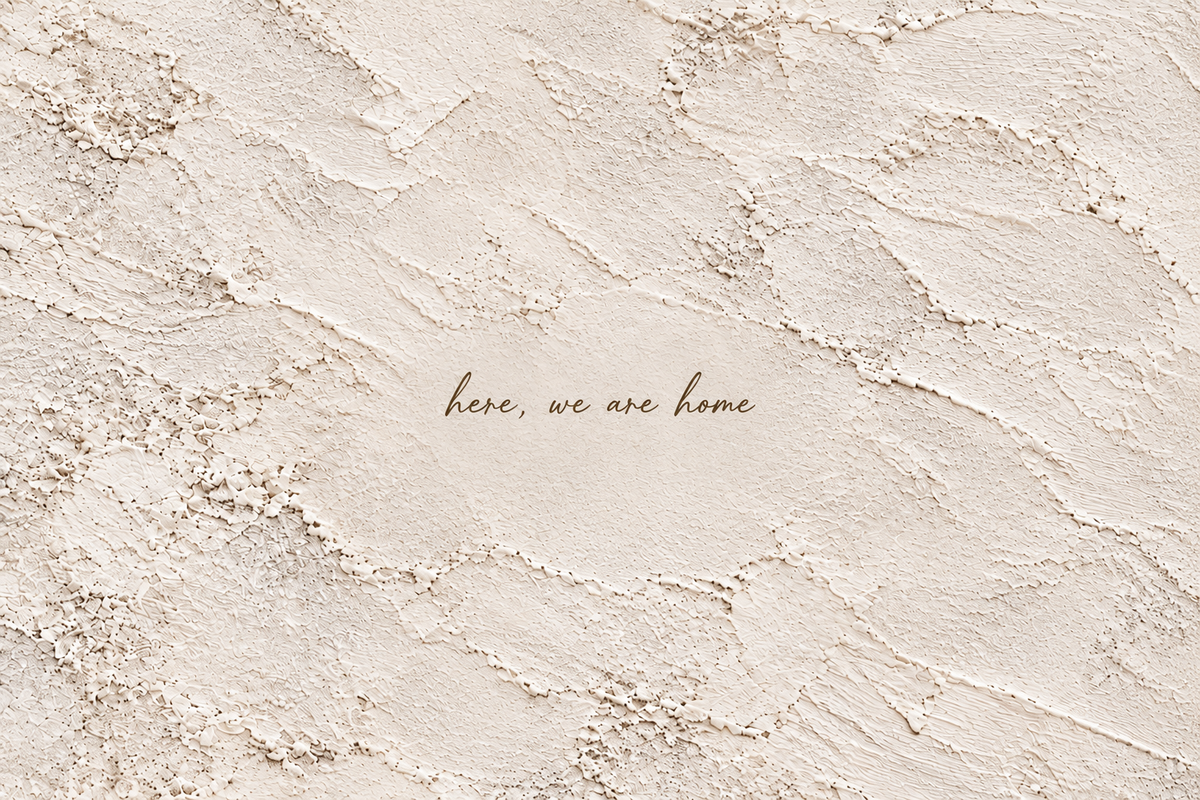 Close detail of the handwritten quote and white plaster-effect artwork