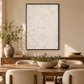 Here We Are Home artwork in a black frame in a dining room