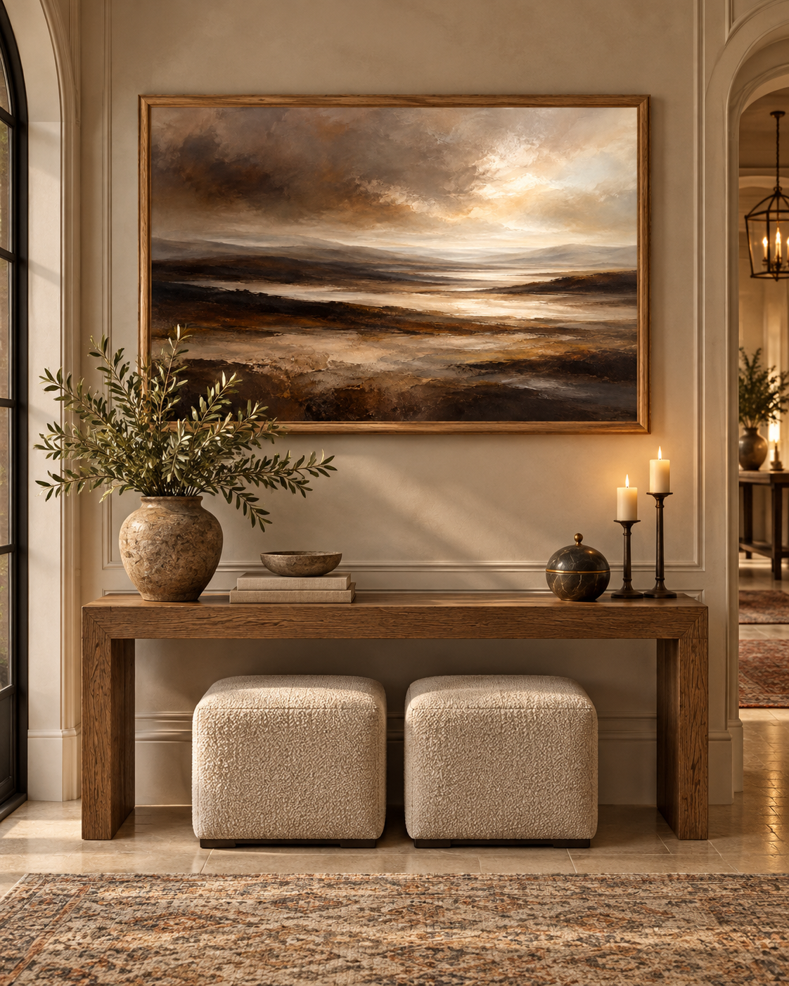 Moody brown landscape artwork above a hallway console