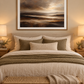 Mounted brown landscape print in a neutral bedroom