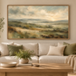 Green abstract landscape in an oak float frame above a neutral sofa
