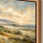 Close-up of green landscape canvas in an oak float frame
