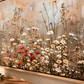Close-up of Wildflower floral wall art in a warm wood float frame showing canvas texture and red poppy details