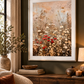 Wildflower floral wall art shown as a mounted framed print in a warm moody interior with cream matting and neutral decor