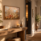 Wildflower landscape wall art in a warm rustic hallway above a wooden console table